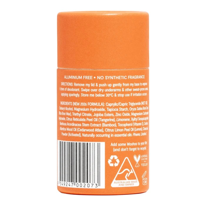 An orange cylindrical bottle of stick of deodorant from Woohoo shown from the back, featuring a white text label with a barcode, ingredients list, and recycling symbols on a white background.