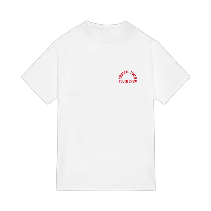 A plain white Crucial Times Comfort Colors short-sleeve t-shirt with small red text reading SUSICAL TIMES YOUTH CREW in a curved, stacked style on the upper left chest. Available now for presale.