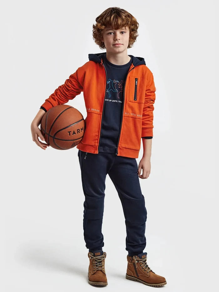 Child wearing the Mayoral Oxido orange and navy two-piece tracksuit, lifestyle view