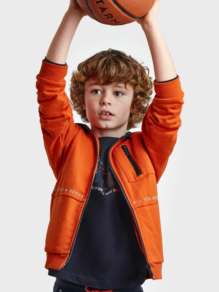 Child wearing the Oxido orange Mayoral zip hoodie with chest pocket, close view