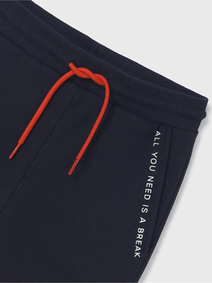 Close view of navy Mayoral tracksuit joggers with drawstring waist and graphic lettering