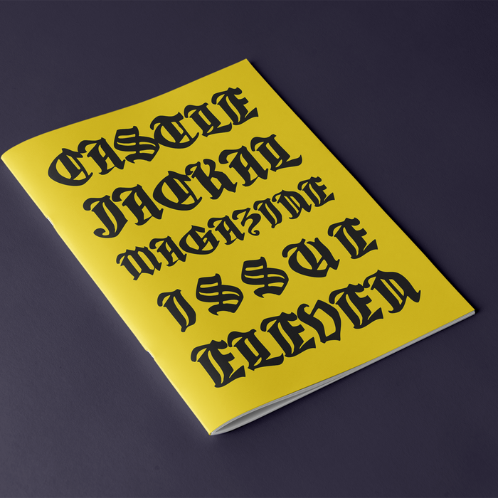 A yellow magazine with bold black Gothic lettering displays "Castle Jackal Magazine Issue Eleven" on the mock cover, set against a dark background.
