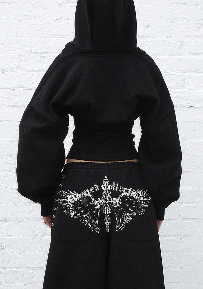 Back view of a black hoodie featuring a corset waist design and custom logo details.