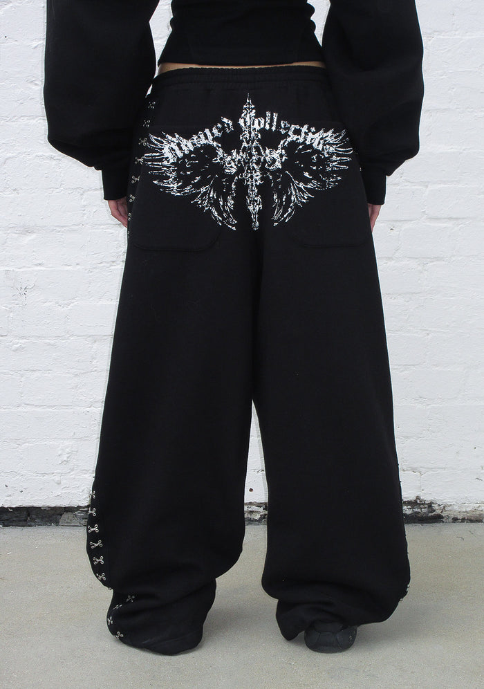Back view of fallen hook and eye oversized sweatpants black showing custom logo design.