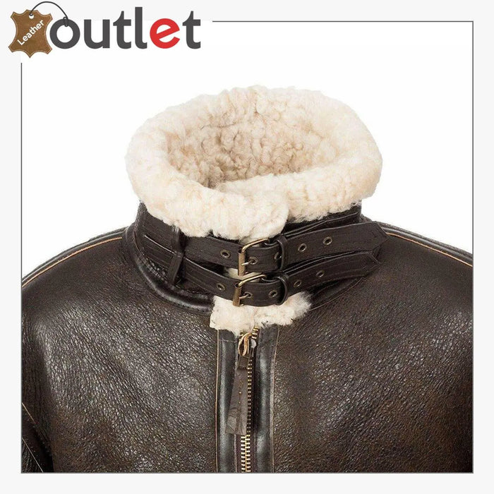 Detail of the metal zip, collar straps and natural cream shearling on the brown B3 jacket