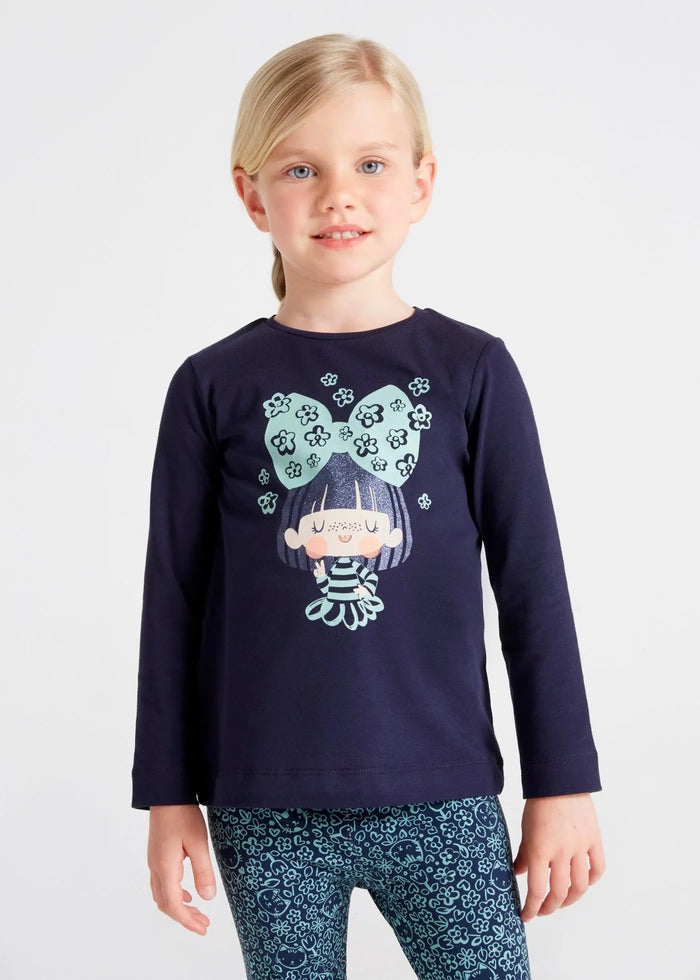 Girl wearing marino navy Mayoral top with mint bow graphic