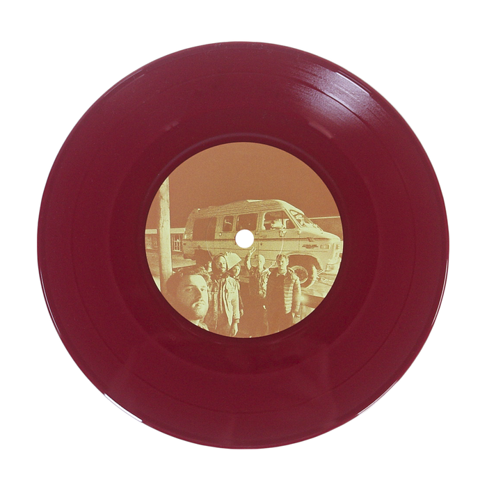 A maroon vinyl record by Sunbloc featuring a sepia center label with people in front of a van—ideal for alternative and hardcore music fans, shown on a plain white background.