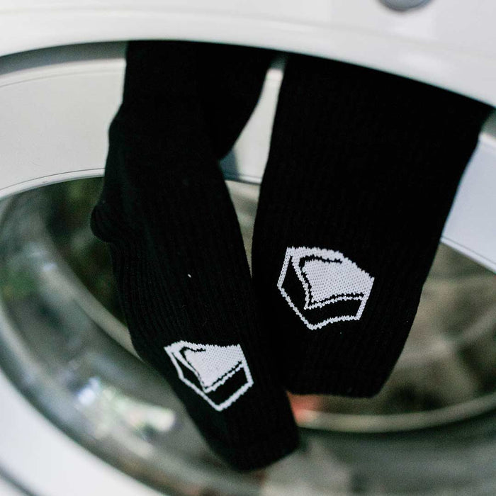 LF x Stinky Crew Socks visible through a washing machine door.