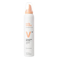 Milk Shake Volumizing Mousse bottle on a white background