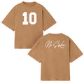 Front and back of a brown Micah Palace Max Heavyweight t-shirt. The front features a large white number 10; the back displays “No Sabo PALACIO” in white script and print on the upper right shoulder.