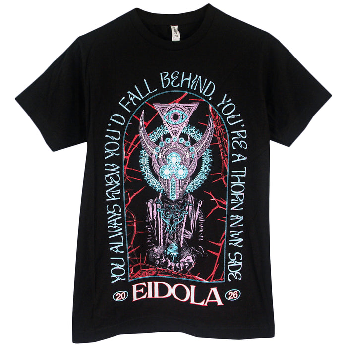 Black t-shirt by Eidola with a detailed, surreal horned mechanical figure and geometric patterns. Text: YOU ALWAYS KNEW YOU’D FALL BEHIND, YOU’RE A THORN AT MY SIDE. “EIDOLA” and “20 26 persevere” at the bottom.