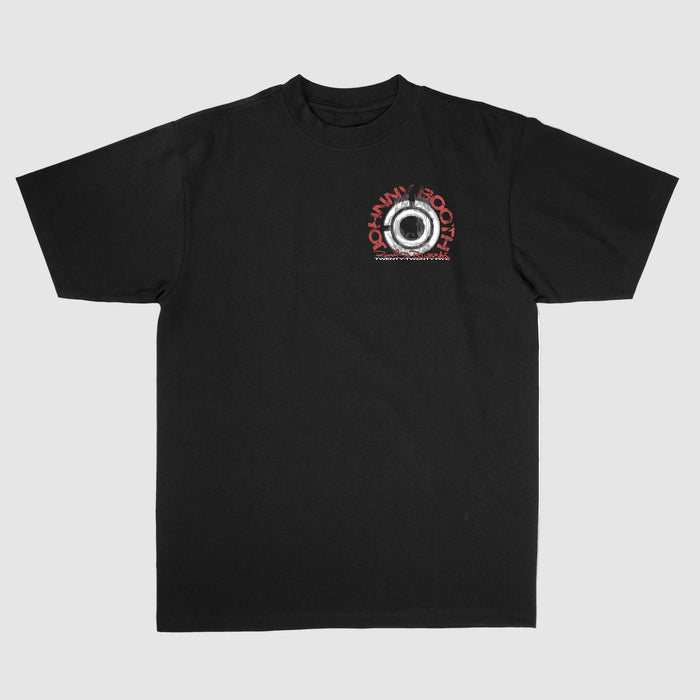 Black t-shirt by Johnny Booth, made from Comfort Colors fabric, featuring a small metallic-look circle graphic on the left chest with JOHNNY BOOTH in red above and white text below—a must-have for printed apparel fans.