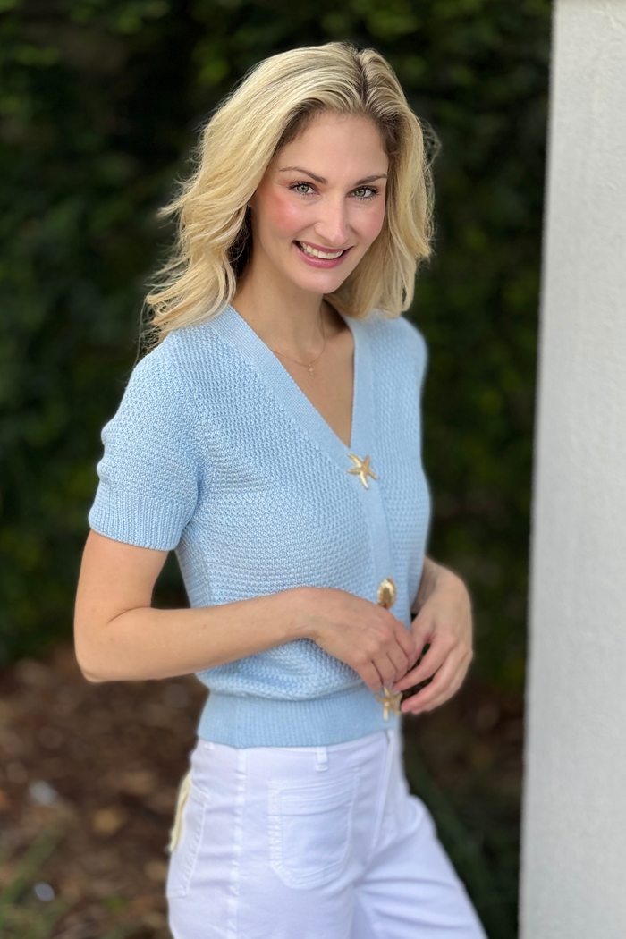 Nautical inspired blue knit top styled with white pants