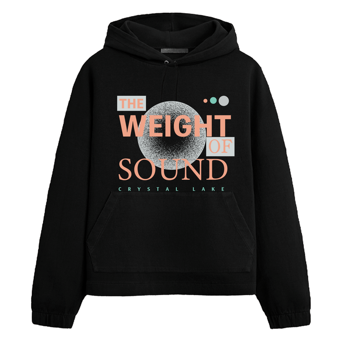 A black Crystal Lake hoodie with "THE WEIGHT OF SOUND" in bold atop a textured circle, and the band name below accented by teal and orange geometric shapes.